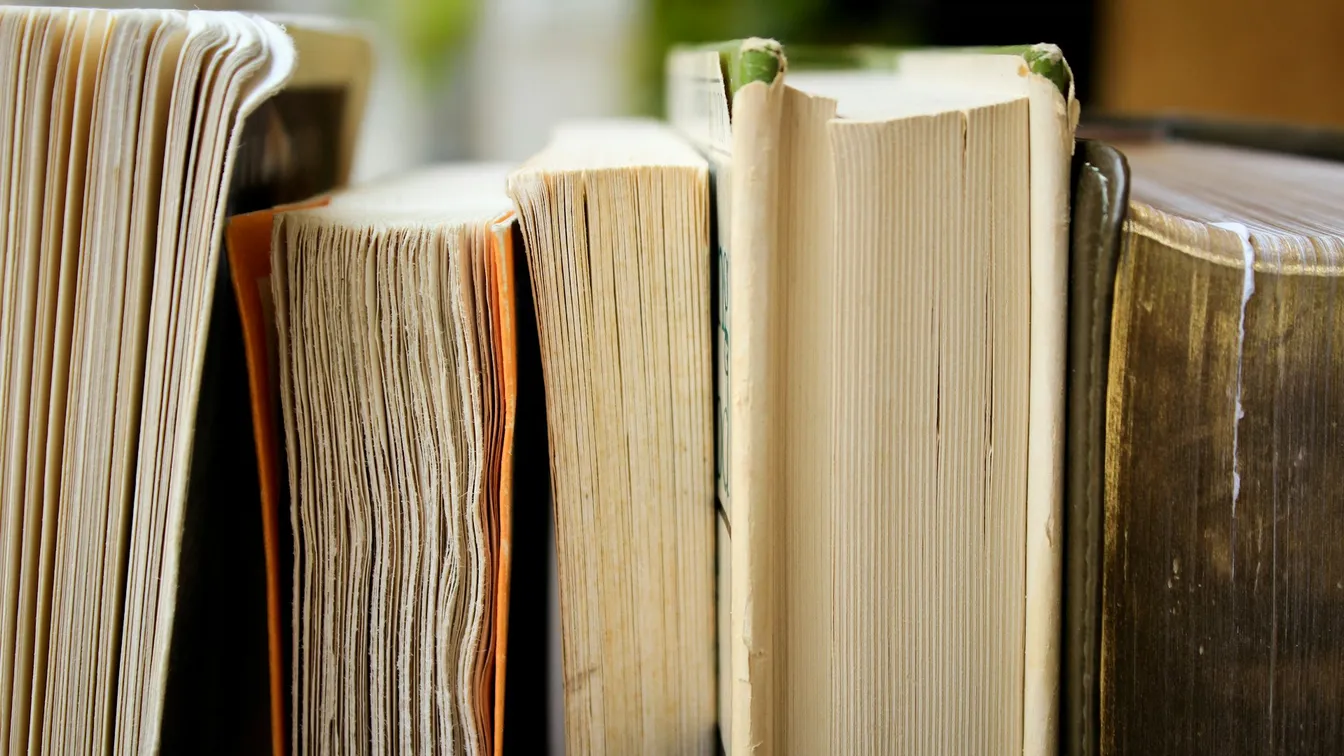 a stack of books on a shelf